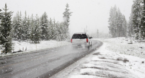 A car driving during heavy snow