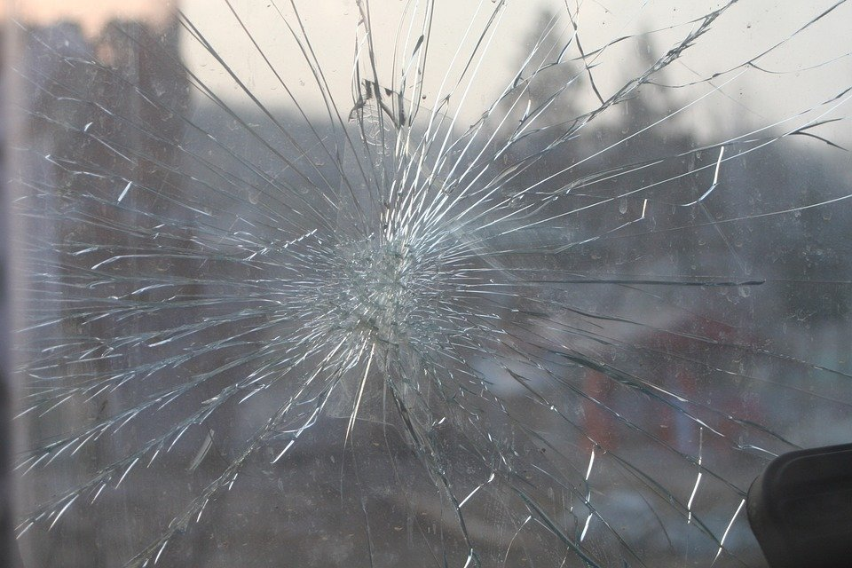 A cracked windshield that needs a windshield replacement in Houston